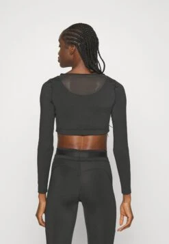 Puma Pamela Reif Tight Long SleeveMaglietta A Manica LungaBlack Donna T-shirt E Top PU141D12A-Q11 -Vendite ONLY 7a38419192504609bca7caf6ae26cbfc